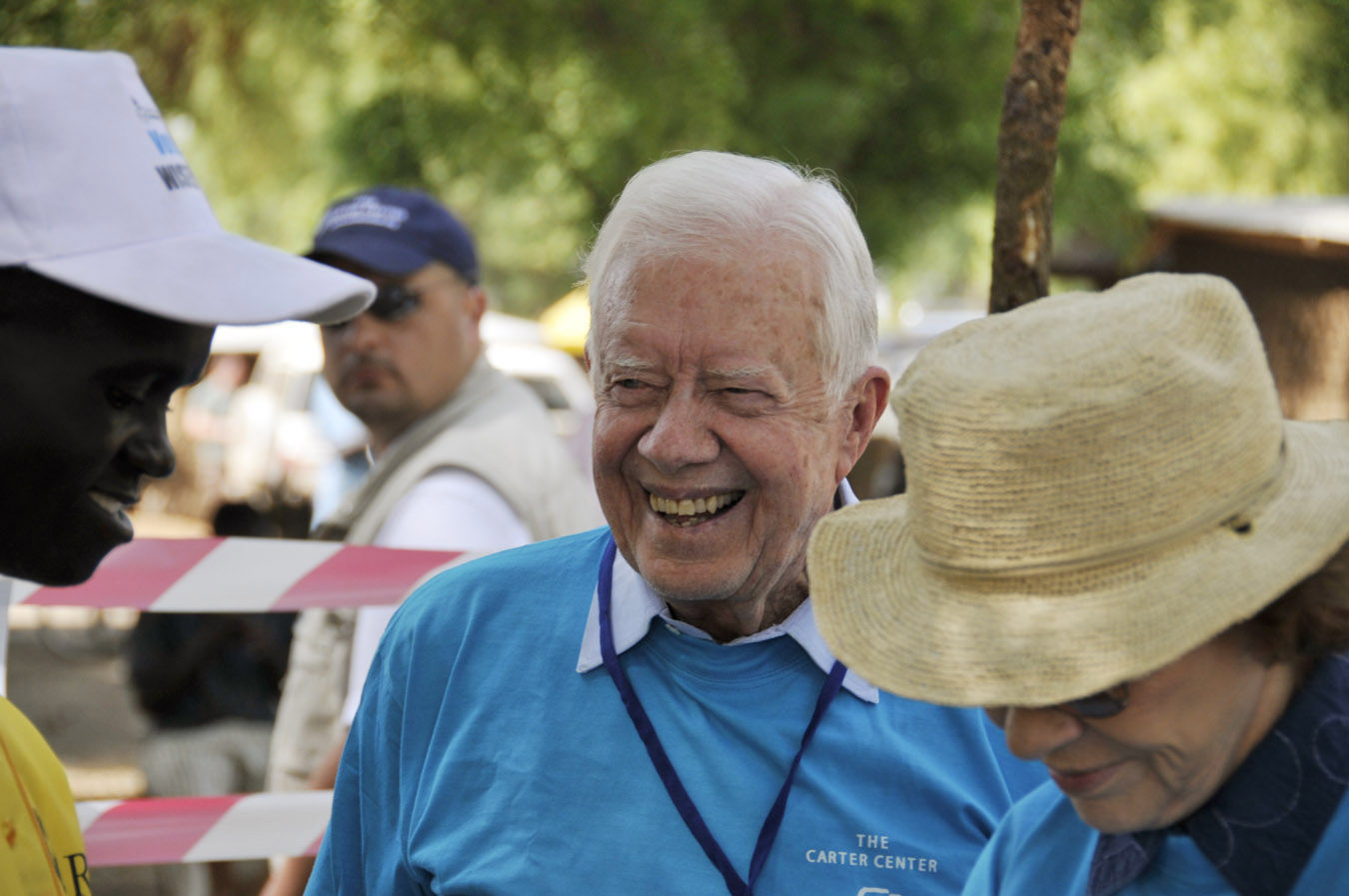 President and Mrs. Carter talk with a polling official outside Juba on Jan. 10.