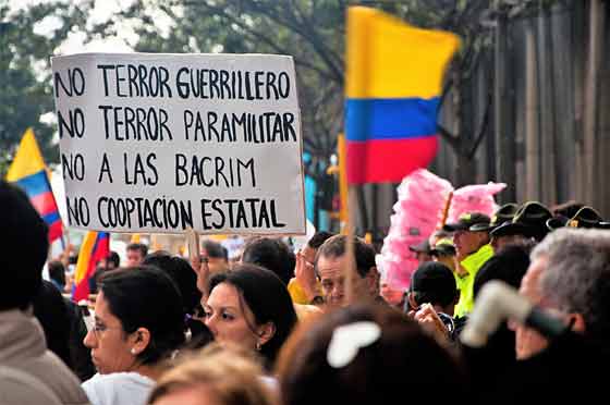 People line the streets of Bogota, Colombia, to protest against the FARC in December 2011.