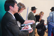 Heather Saul and Xu Jialiang watch the electoral process.