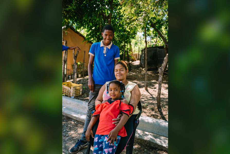 Maria de los Santos with son and daughter.