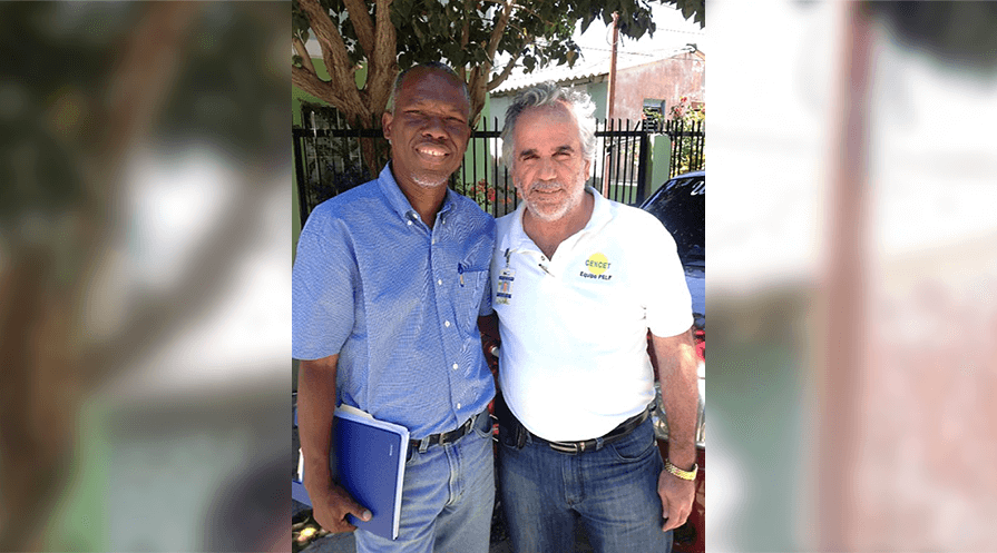 Dr. Madsen Beau de Rochars of Haiti, left, and Dr. Manuel Gonzales of the Dominican Republic work closely together toward the elimination of malaria and lymphatic filariasis across difficult geopolitical, cultural, and linguistic lines. (Photo: The Carter Center/ G. Noland)