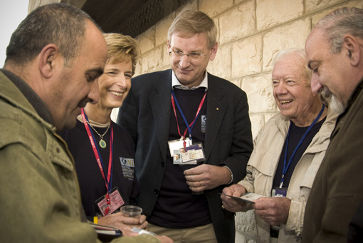 The Carter Center sent observers to the Jan. 9, 2005, election for president of the Palestinian Authority. The 80-member multinational delegation was co-led by former U.S. President Jimmy Carter, former Swedish Prime Minister Carl Bildt, and former New Jersey Governor Christine Todd Whitman. Pictured is an early voter in the West Bank.