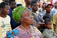 A village elder learns about her new rights from members of the Carter Center sponsored Modia Drama Club.